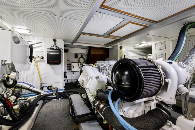 Tumbleweed Yacht Photos Pics Engine room of 2016 North Pacific 49 Pilothouse yacht, showcasing machinery and equipment.