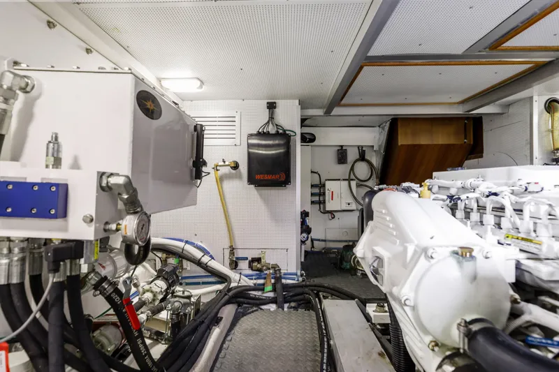 Tumbleweed Yacht Photos Pics Engine room of a 2016 North Pacific 49 Pilothouse yacht, showcasing mechanical components.