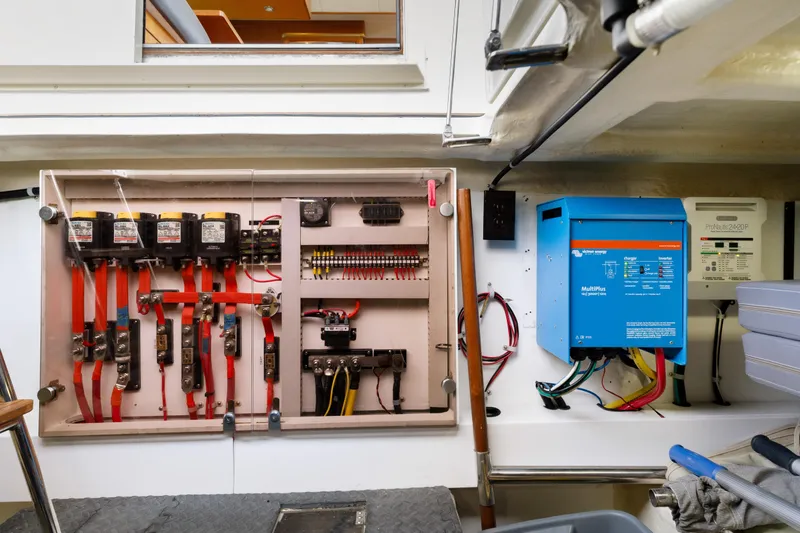 Tumbleweed Yacht Photos Pics Electrical system of a 2016 North Pacific 49 Pilothouse yacht, featuring wiring and control panels.