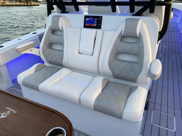  Yacht Photos Pics Luxurious seating on a 2021 Freeman 42 LR boat with elegant upholstery and modern design.