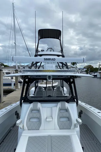  Yacht Photos Pics Freeman 42 LR boat, 2021 model, docked with Simrad equipment, under cloudy skies.