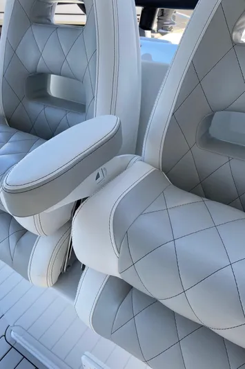  Yacht Photos Pics Luxurious white leather seats with diamond stitching in a 2021 Freeman 42 LR boat.
