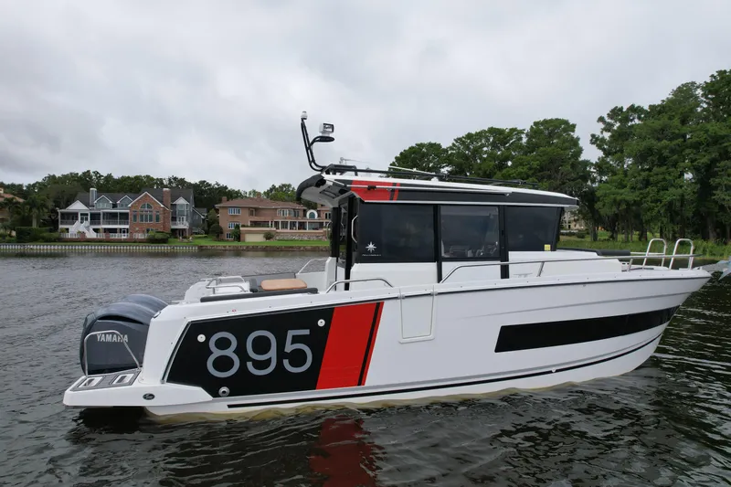 Yacht Photos Pics 2023 Jeanneau NC Sport 895 boat on water, side view with modern design.