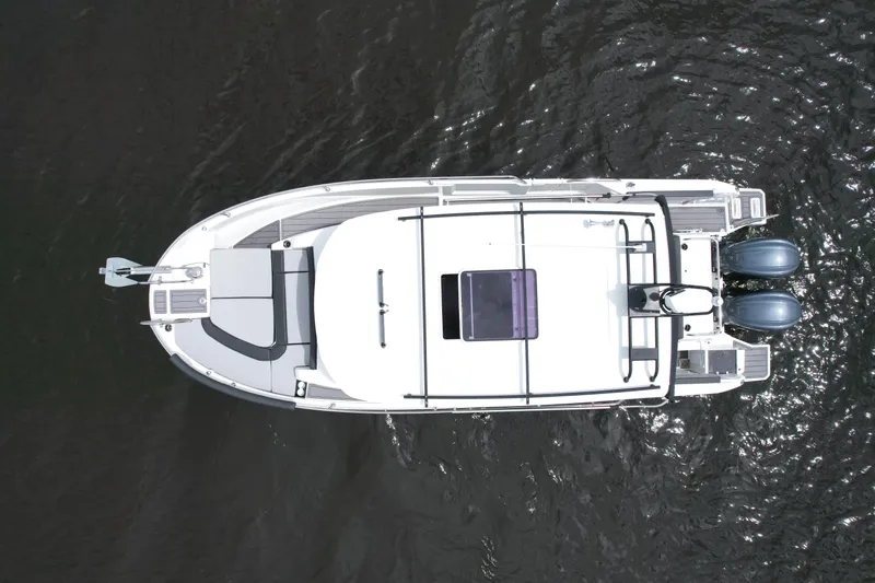  Yacht Photos Pics 2023 Jeanneau NC Sport 895 boat, aerial view, on water.