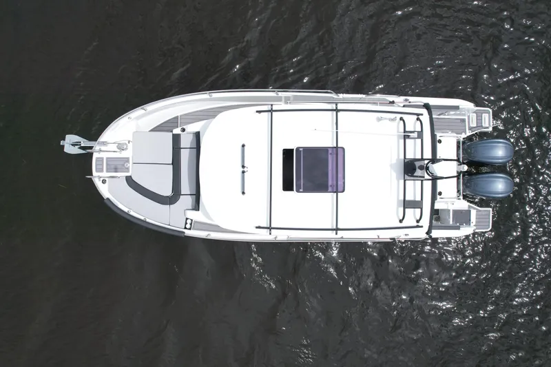  Yacht Photos Pics Aerial view of 2023 Jeanneau NC Sport 895 boat on water.