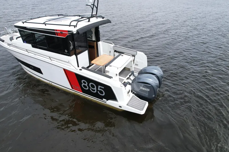  Yacht Photos Pics 2023 Jeanneau NC Sport 895 boat with twin Yamaha engines on water.