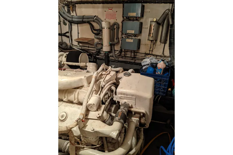 Sky To Sea Yacht Photos Pics Engine room of 1984 Hatteras 53 Extended Deckhouse Motor Yacht, showing machinery and equipment.