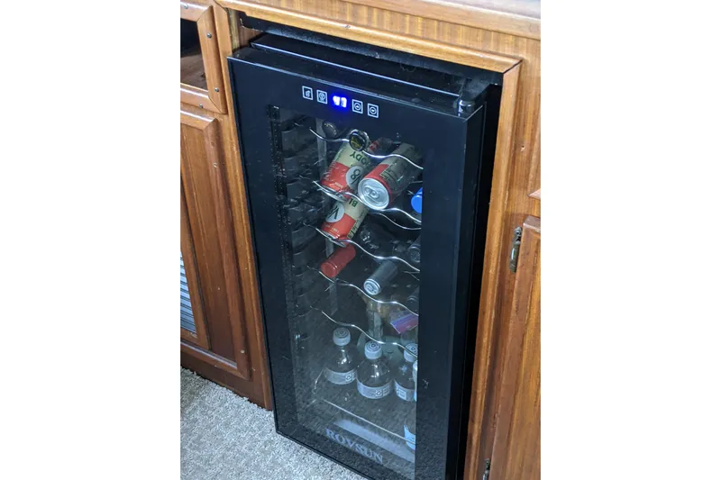 Sky To Sea Yacht Photos Pics Mini fridge stocked with beverages on 1984 Hatteras 53 Extended Deckhouse Motor Yacht.