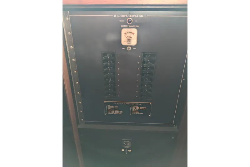 Sky To Sea Yacht Photos Pics Electrical panel of 1984 Hatteras 53 Extended Deckhouse Motor Yacht, showing battery condition and switches.