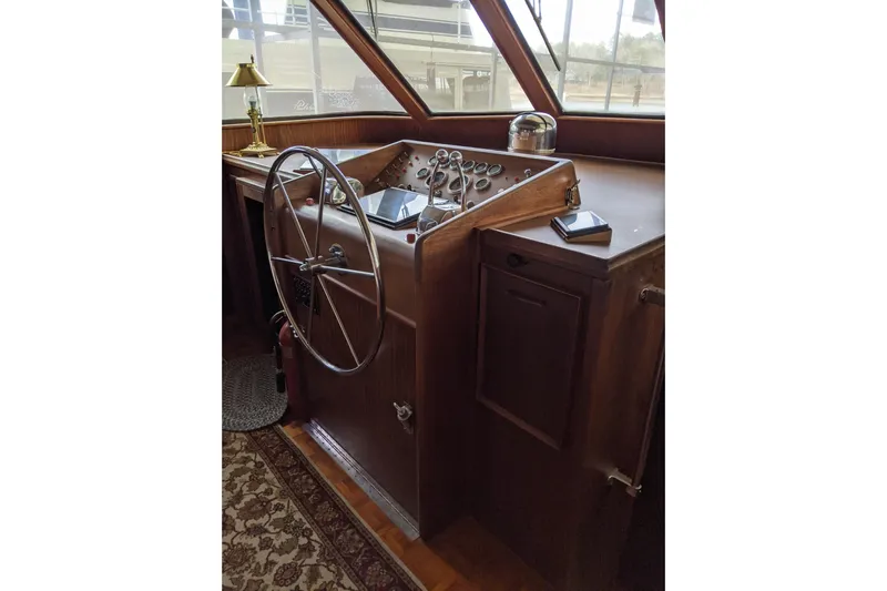 Sky To Sea Yacht Photos Pics 1984 Hatteras 53 Motor Yacht helm with wooden dashboard and steering wheel.