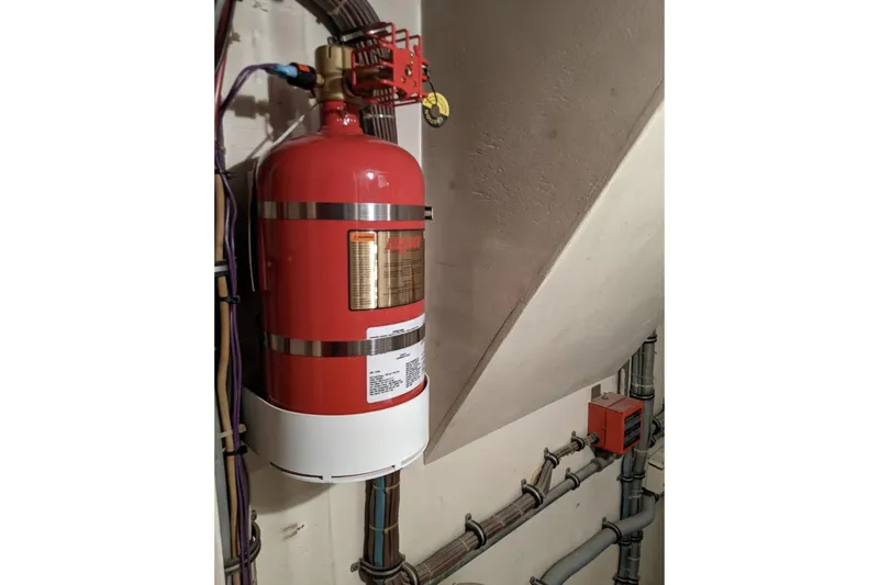 Sky To Sea Yacht Photos Pics Fire suppression system in 1984 Hatteras 53 Extended Deckhouse Motor Yacht engine room.