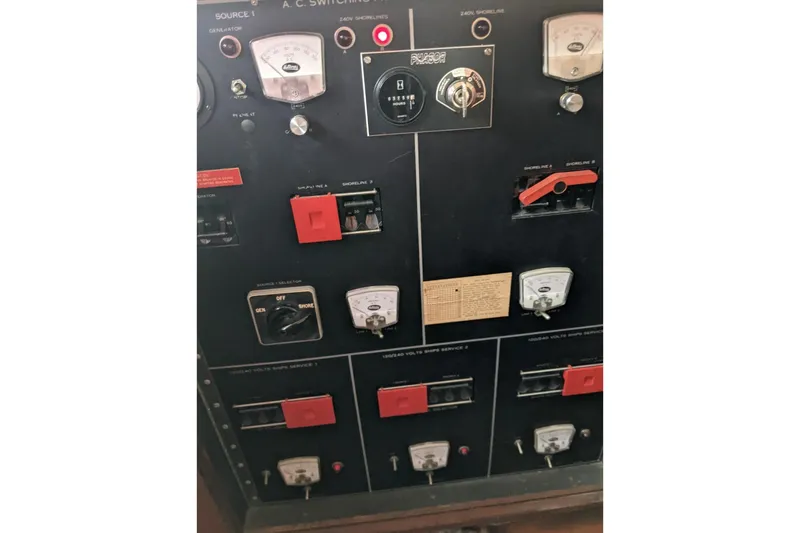 Sky To Sea Yacht Photos Pics Control panel of a 1984 Hatteras 53 Extended Deckhouse Motor Yacht, featuring gauges and switches.