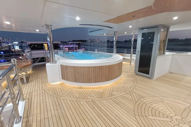 Sehamia Yacht Photos Pics Luxurious deck of 2018 Gulf Craft Majesty 155 yacht with hot tub and elegant wood flooring.