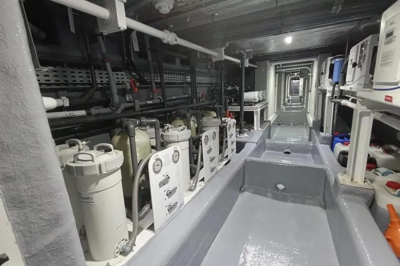 Sehamia Yacht Photos Pics Engine room of 2018 Gulf Craft Majesty 155 yacht, showcasing machinery and equipment.