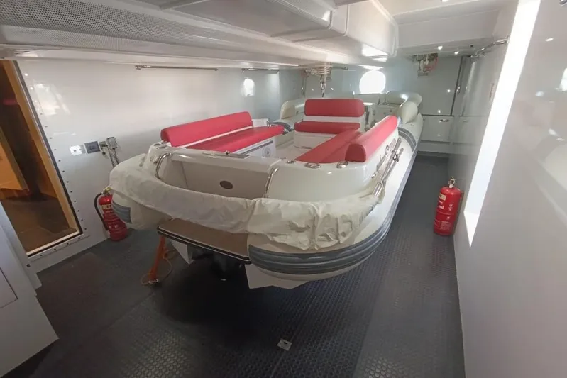 Sehamia Yacht Photos Pics 2018 Gulf Craft Majesty 155 yacht interior with red seating and safety equipment.