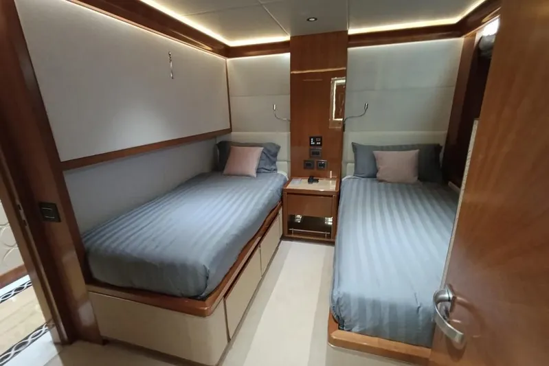Sehamia Yacht Photos Pics Luxurious twin bedroom on 2018 Gulf Craft Majesty 155 yacht, featuring modern design and cozy ambiance.