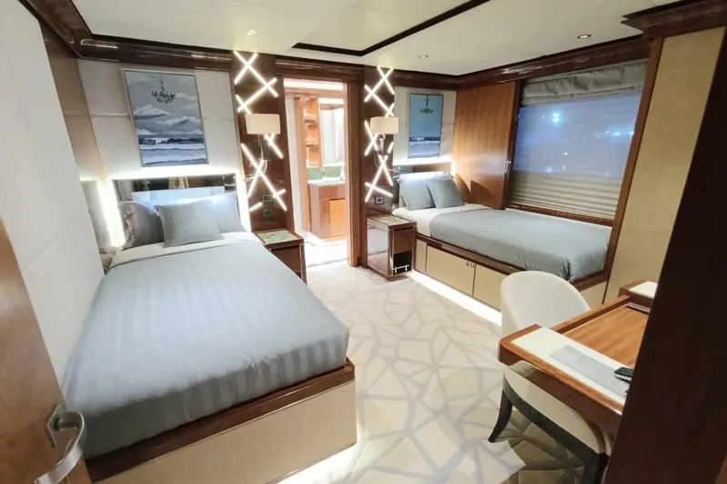Sehamia Yacht Photos Pics Luxurious cabin interior of 2018 Gulf Craft Majesty 155 yacht with twin beds and elegant decor.