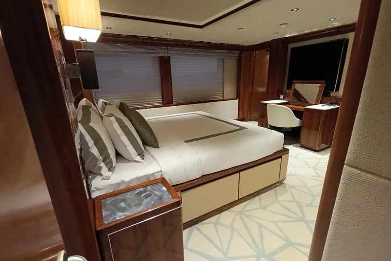 Sehamia Yacht Photos Pics Luxurious bedroom interior on 2018 Gulf Craft Majesty 155 yacht, featuring elegant furnishings and decor.