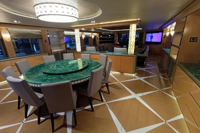 Sehamia Yacht Photos Pics Luxurious interior of 2018 Gulf Craft Majesty 155 yacht with elegant dining area and modern decor.