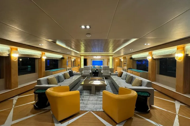 Sehamia Yacht Photos Pics Luxurious interior of 2018 Gulf Craft Majesty 155 yacht with elegant seating and ambient lighting.