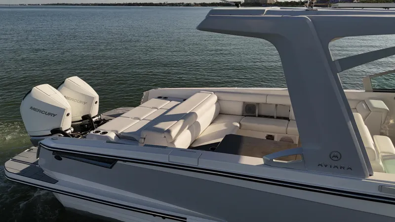  Yacht Photos Pics 2021 Aviara AV32 OB boat with twin Mercury outboard engines on calm water.