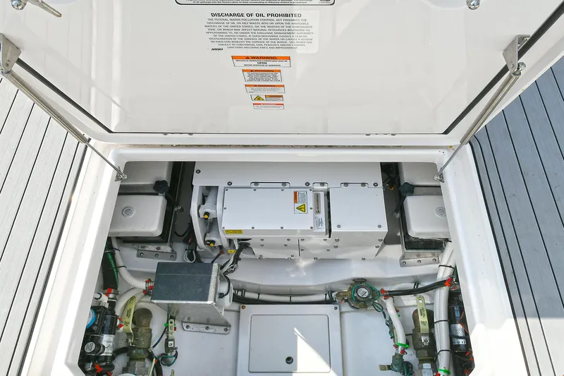 Fourtuna 2 Yacht Photos Pics Engine compartment of 2023 Everglades 455 Center Console boat, showcasing mechanical components.