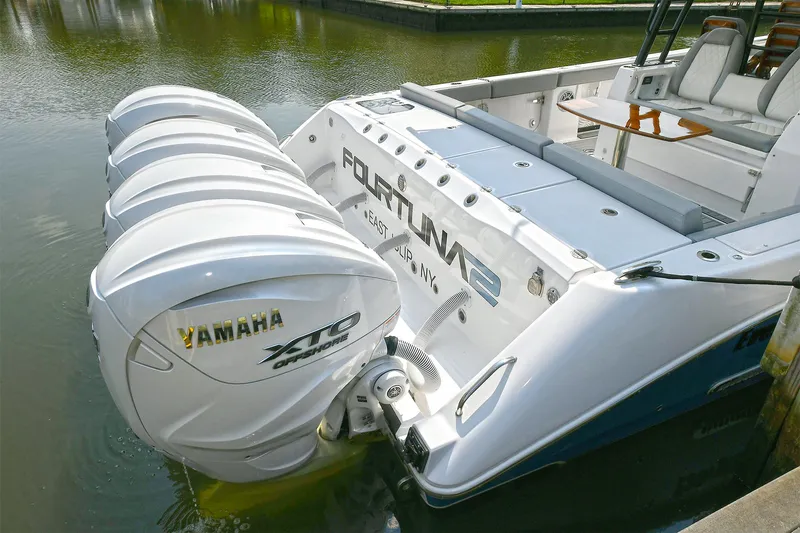 Fourtuna 2 Yacht Photos Pics 2023 Everglades 455 Center Console with Yamaha XTO engines docked in calm waters.