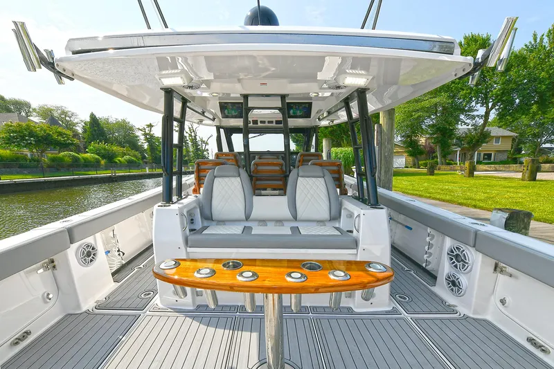 Fourtuna 2 Yacht Photos Pics 2023 Everglades 455 Center Console boat interior with seating and rod holders.