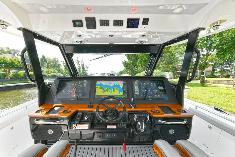 Fourtuna 2 Yacht Photos Pics 2023 Everglades 455 Center Console boat cockpit with advanced navigation displays.