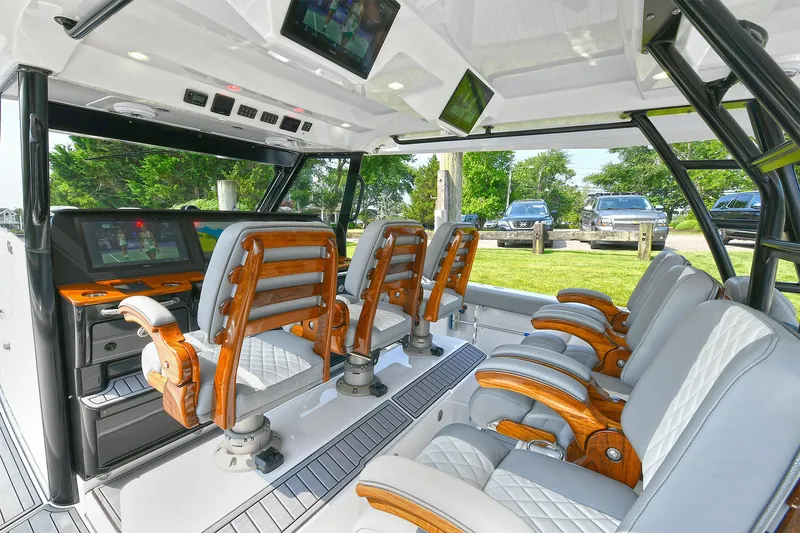 Fourtuna 2 Yacht Photos Pics 2023 Everglades 455 Center Console interior with luxurious seating and advanced navigation displays.