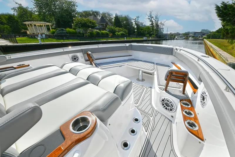 Fourtuna 2 Yacht Photos Pics 2023 Everglades 455 Center Console boat interior with luxurious seating and cup holders.