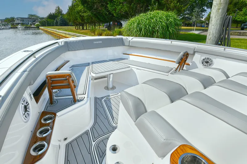 Fourtuna 2 Yacht Photos Pics Luxurious seating on 2023 Everglades 455 Center Console boat, featuring sleek design and comfort.