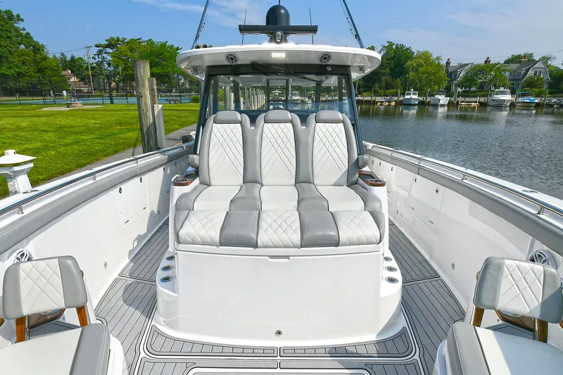 Fourtuna 2 Yacht Photos Pics 2023 Everglades 455 Center Console boat with luxurious seating and sleek design.