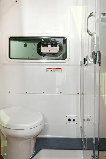 Fourtuna 2 Yacht Photos Pics 2023 Everglades 455 Center Console boat bathroom interior with modern fixtures.