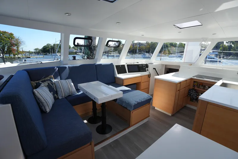 Talise Yacht Photos Pics Luxurious interior of 2024 Balance 442 yacht with modern seating and navigation area.