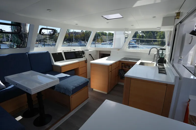 Talise Yacht Photos Pics Modern interior of 2024 Balance 442 yacht with spacious seating and kitchen area.
