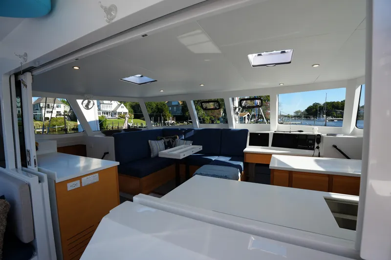 Talise Yacht Photos Pics Luxurious interior of 2024 Balance 442 yacht with modern seating and panoramic windows.