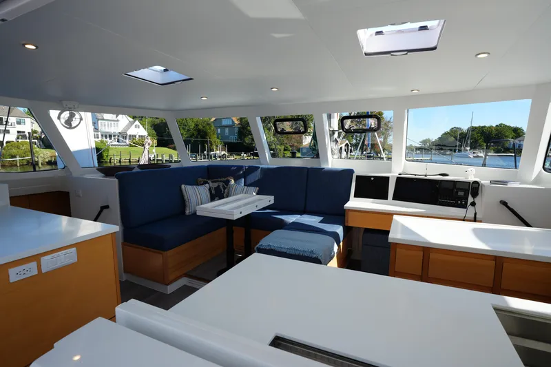 Talise Yacht Photos Pics Luxurious interior of 2024 Balance 442 yacht with modern seating and scenic views.
