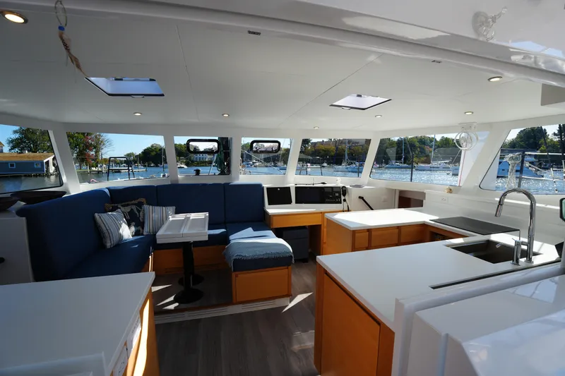 Talise Yacht Photos Pics Luxurious interior of 2024 Balance 442 yacht with modern kitchen and seating area.