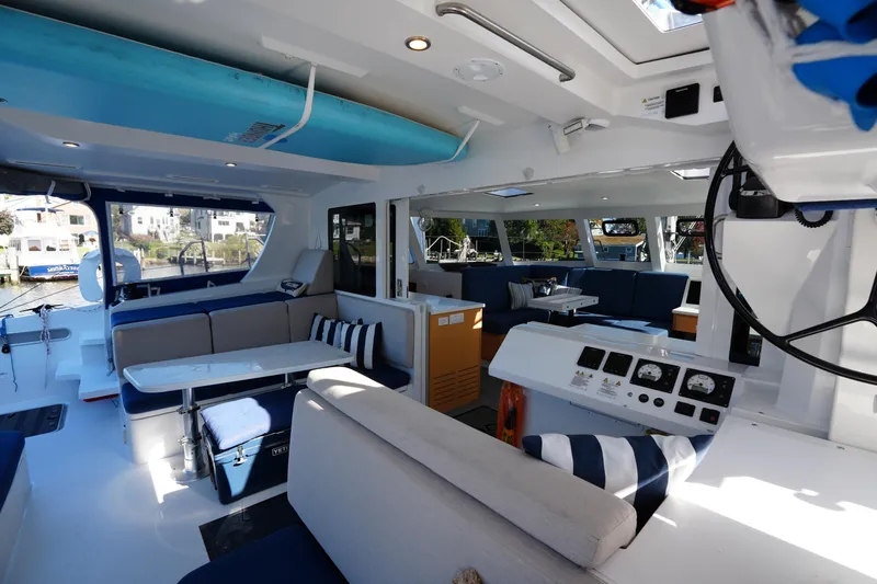Talise Yacht Photos Pics Luxurious interior of 2024 Balance 442 catamaran with modern seating and navigation equipment.