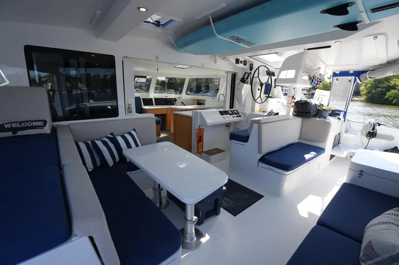 Talise Yacht Photos Pics Luxurious interior of 2024 Balance 442 catamaran with modern seating and navigation area.