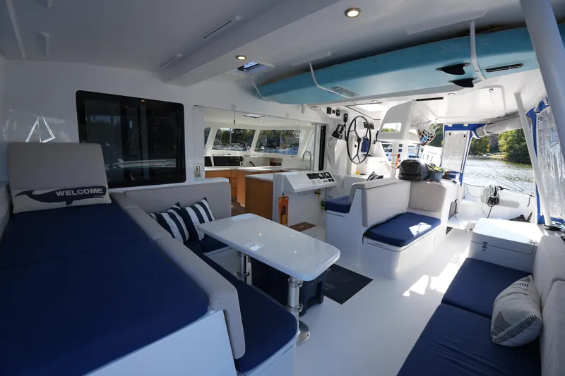 Talise Yacht Photos Pics Luxurious interior of 2024 Balance 442 catamaran with modern seating and navigation area.