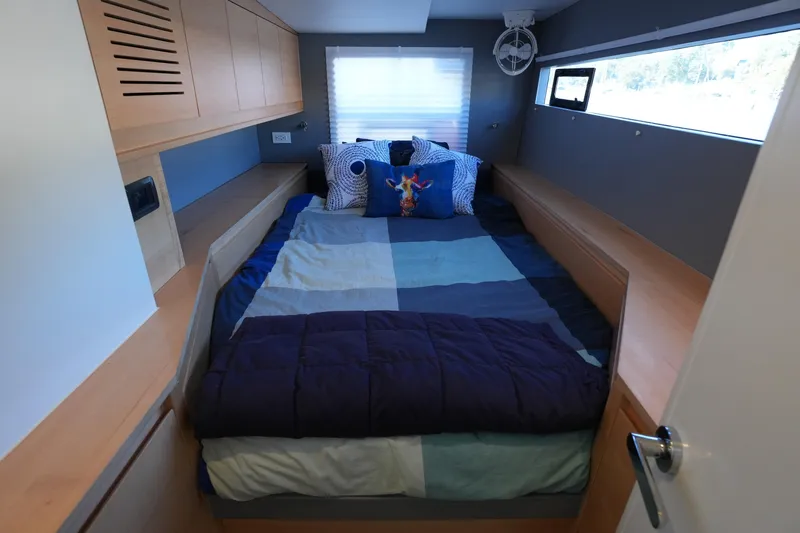 Talise Yacht Photos Pics Cozy bedroom in 2024 Balance 442 yacht with modern design and colorful bedding.