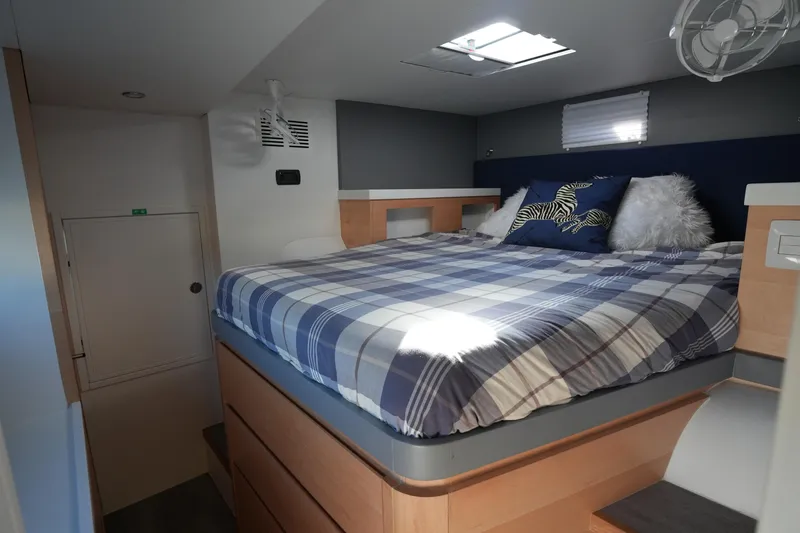 Talise Yacht Photos Pics 2024 Balance 442 interior with cozy bed, plaid bedding, and modern design elements.