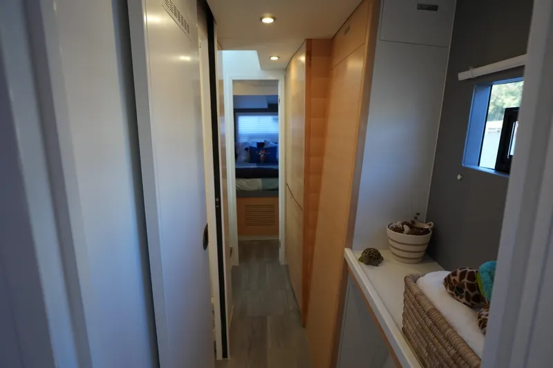 Talise Yacht Photos Pics Narrow hallway in 2024 Balance 442 yacht, featuring modern design and cozy interior.