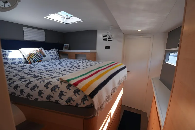 Talise Yacht Photos Pics Cozy bedroom in 2024 Balance 442 yacht with skylight and colorful bedding.