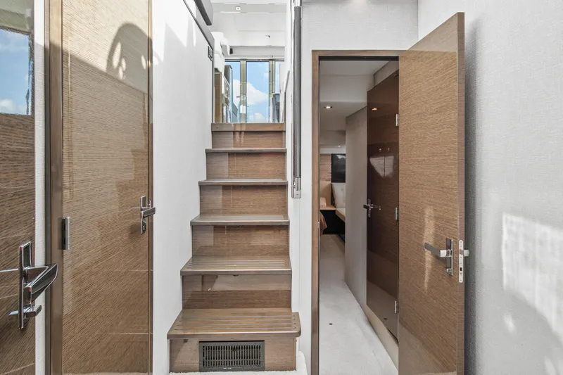  Yacht Photos Pics Interior stairs and hallway of 2019 Cruisers 50 Cantius yacht.