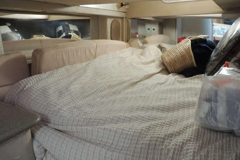  Yacht Photos Pics Interior cabin of a 2001 Formula 400 Super Sport boat with cozy bedding.