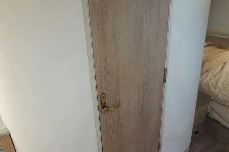  Yacht Photos Pics Wooden door inside 2001 Formula 400 Super Sport boat cabin.