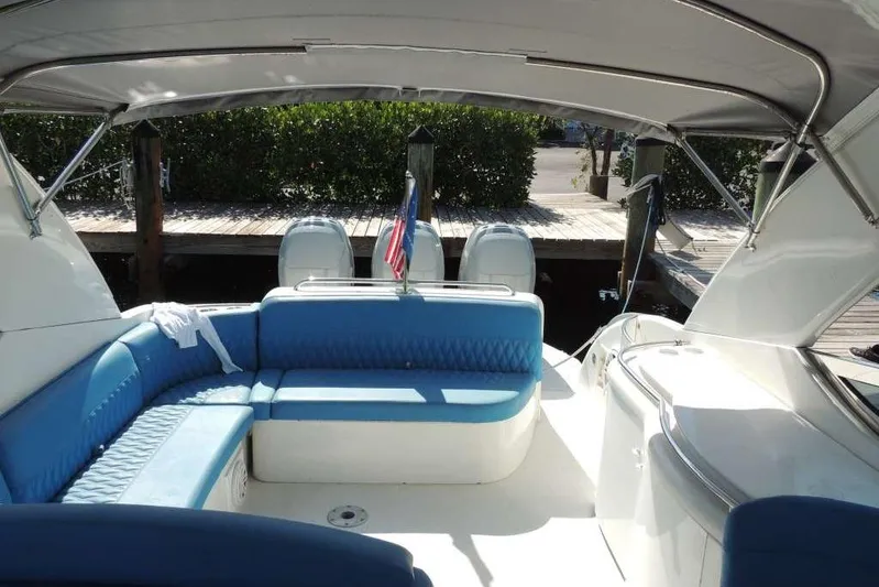  Yacht Photos Pics 2001 Formula 400 Super Sport boat interior with blue seating and canopy.